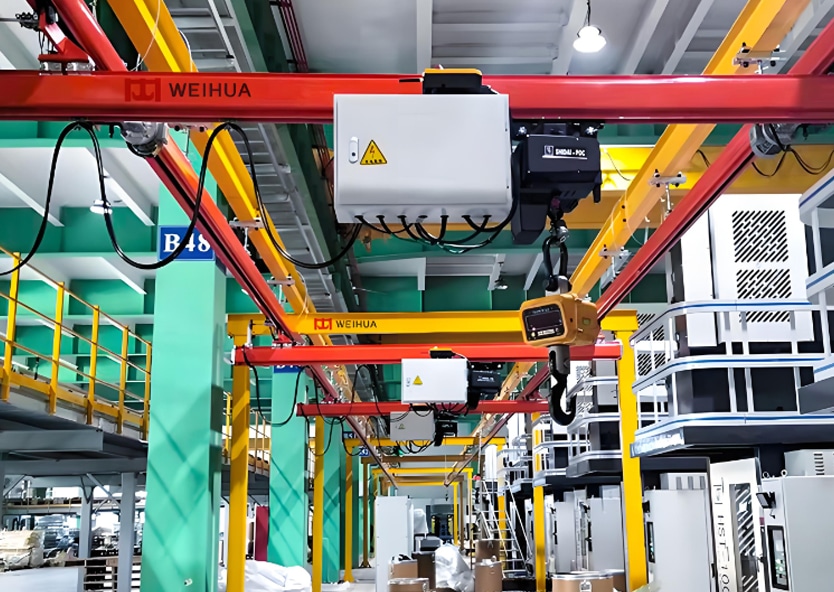 Electric hoist mounted on a KBK crane