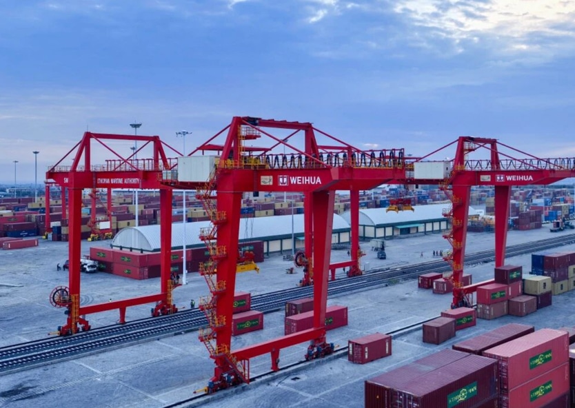 RMG cranes handling containers in the railway yard.